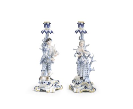 A pair of Meissen figural candlesticks, late 19th centuryModelled by E.A. Leuteritz after the models by J.J. Kaendler, depict