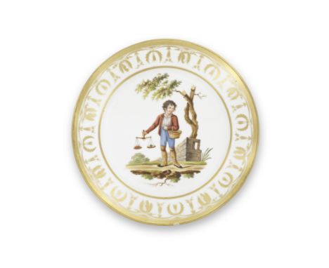 A Paris porcelain plate, 19th centuryDecorated with a boy holding scales and a basket of fruit in a landscape, the rim with a