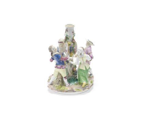 A Meissen figural candlestick, circa 1770Modelled as two boys and two girls holding hands and dancing around a candlestick, p