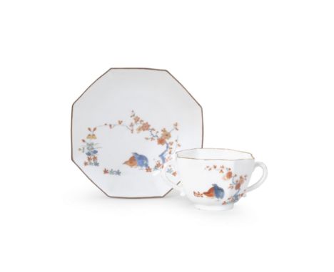 A Meissen octagonal double-handled beaker and saucer, circa 1730Painted in Kakiemon style with the 'Quail' pattern, brown-edg