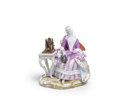 A Meissen figure of a lady at a spinning wheel, late 19th centuryAfter an 18th century model by J.J. Kaendler, seated in a hi