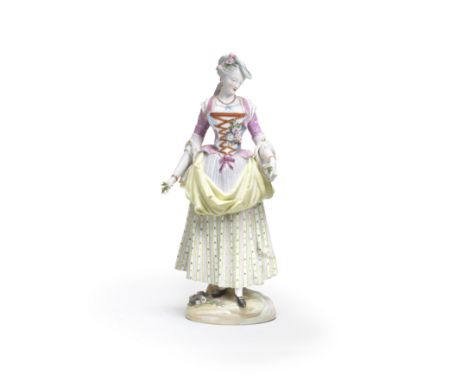 A Dresden porcelain figure of a lady, late 19th centuryWearing a turquoise hat, pink bodice with laced stomacher, a striped a