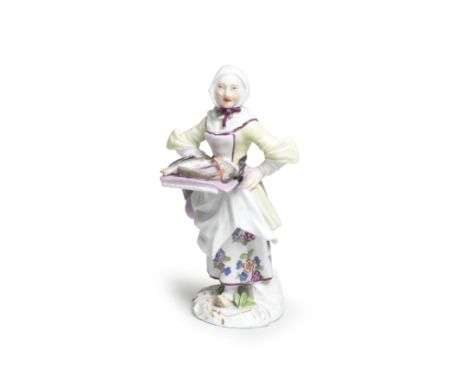 A Meissen 'Cris de Paris' figure of a fish seller, circa 1755Modelled by Peter Reinicke, wearing a white headscarf, yellow bo