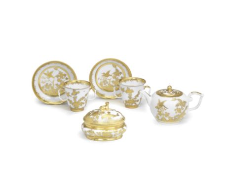 A Meissen Hausmaler part tea service, circa 1740-50Decorated in Augsburg, with finely tooled gilding over an underglaze-blue 