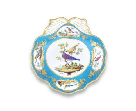 A Sèvres later-decorated shell-shaped dish (compotier coquille), the porcelain 18th centuryThe blue ground reserved with gilt