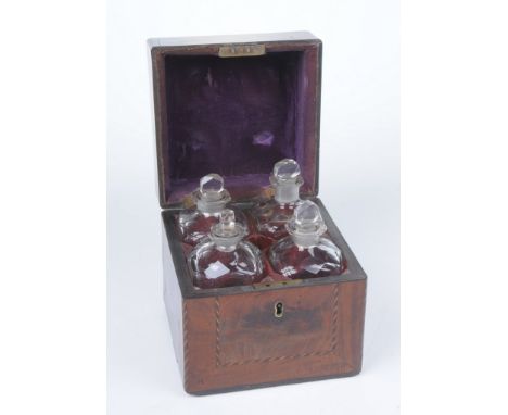 A 19th Century mahogany travelling liquor decanter box
The square section box, with architectural cover and ebonised inlaid s