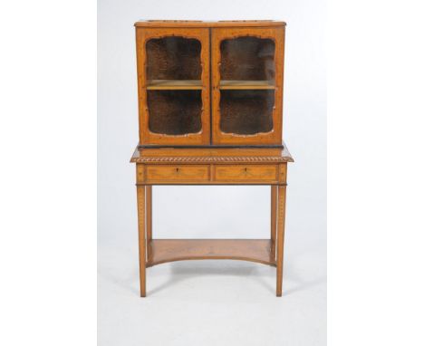 A French satin wood bonheur du jour,
the glazed cabinet with two oval shaped glazed apertures above two similarly glazed cupb