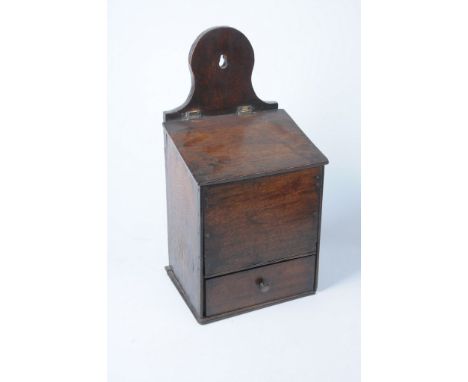 A 19th Century oak hanging candle box
The arched upper bracket extending to a sloped front, the hinged cover revealing empty 