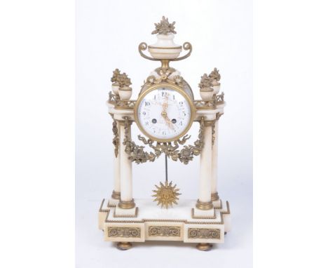 A French alabaster and gilt metal mantel clock, late 19th Century
The architectural casing, surmounted by a twin handled urn,