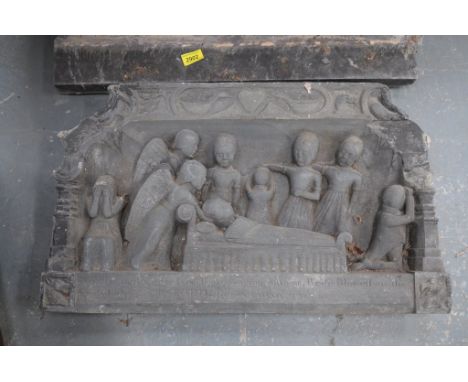 A Victorian carved stone wall plaque, possibly slate
The shaped rectangular plaque carved in high relief with an ecclesiastic
