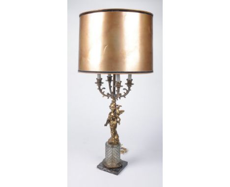 A French gilt metal Louis XVI style four branch, five light table lamp
The four scroll from a central stem supporting a gold 