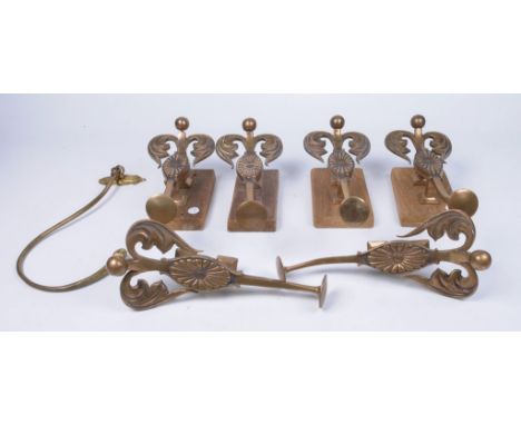 A set of six cast and polished metal curtain tie backs, early 20th Century
Each extending from a square terminal to a flowerh