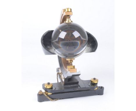 A Campbell-Stokes pattern Sunshine Recorder, by Casella of London
The glass sphere supported on an ebonised carved base with 