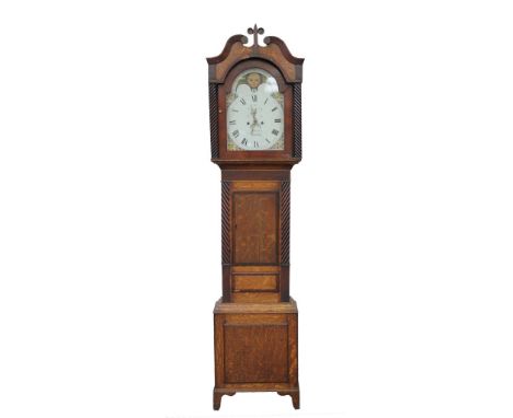 An early 19th Century mahogany and oak cased eight-day longcase clock
The twin swan neck upper pediment with central fleur sc