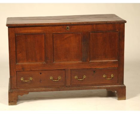 An 18th Century and later oak blanket chest
The two plank rectangular moulded top above three inverted panels and two frieze 