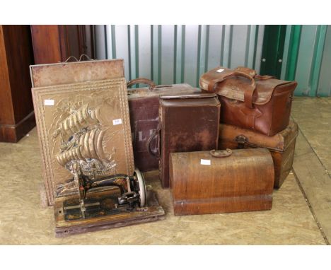 A painted tin box, sewing machine, brass fireguard and three leather cases