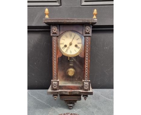 A small antique Continental musical wall clock,&nbsp;42cm high; together with a carved walnut aneroid barometer. (2) 