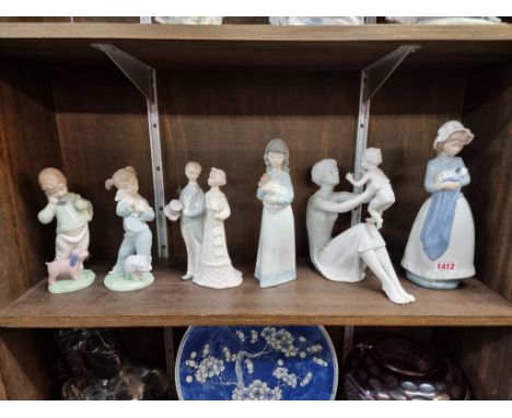 Five Nao figures,&nbsp;largest 25cm high; together with a Kaiser blanc de chine figure group, 21.5cm high. (6) 