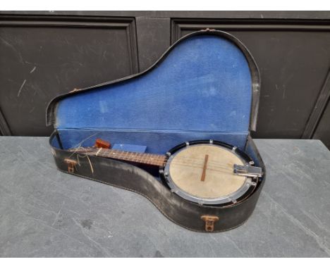 An old eight string banjo mandolin, in case.&nbsp; 