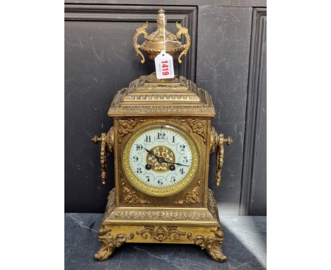 A circa 1900 century brass mantel clock, 40cm&nbsp;high, with pendulum. 