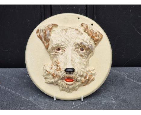 A Clarice Cliff 'Highland Terrier' wall plaque,&nbsp;22.5cm wide. 
