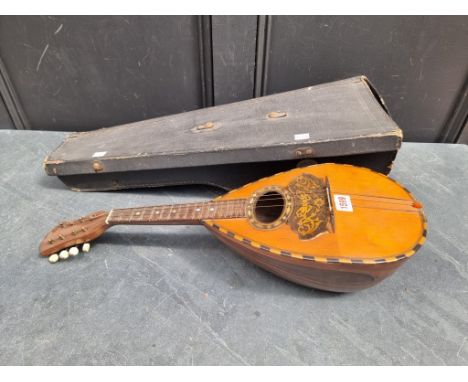 An Italian eight string mandolin,&nbsp;labelled 'Gennaro Maglioni, Napoli', in case.&nbsp; 