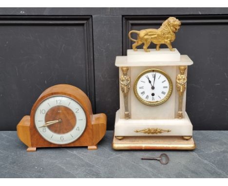 An onyx and gilt metal mantel clock,&nbsp;39cm high; together with a 1940s walnut mantel timepiece. (2) 