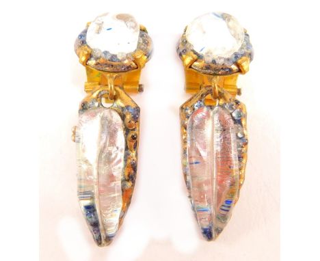 A pair of French clip-on earrings, with pink enamel backs, and crystal set fronts, in copper design, each earring 4.5cm high.