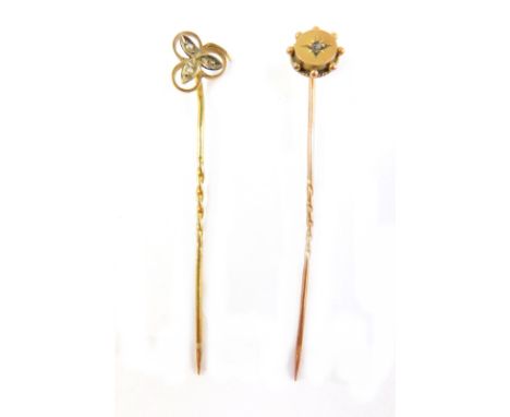 Two 9ct gold stick pins, comprising one of three leaf clover design, set with seed pearls, (AF), and another of Victorian des