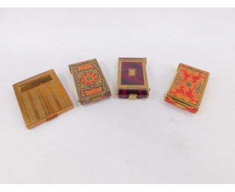 Two mid 20thC brass and tooled red leather lipstick compacts, a brass and faux red tortoiseshell lipstick compact, and a bras