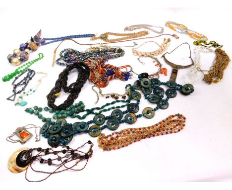 Modern jewellery necklaces, including a heart shaped pendant, brass necklace, wooden beaded necklaces, faux pearl necklace, e