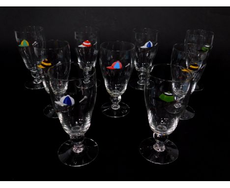 A set of nine mid 20thC ale glasses, enamel decorated with riding caps and crops.