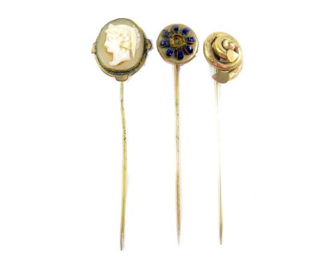 Three stick pins, to include one set with oval cameo, all gilt metal. 