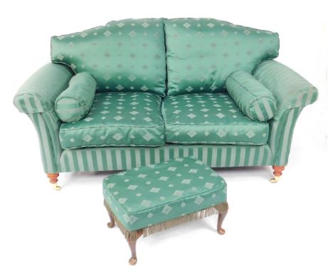 A two seater sofa upholstered in green floral and contrasting striped fabric, 97cm H, 177cm W, 90cm D, together with a matche