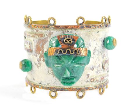 A Mexican costume jewellery bangle, with applied malachite type carved stone, with white painted backing, stamped hecho en Me