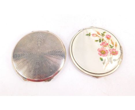 A George VI silver circular compact with engine turned decoration, Birmingham 1941, and a George VI silver and guilloche enam