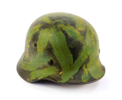 A German Third Reich army camouflage helmet, M35, stamped number 355 and 390. 