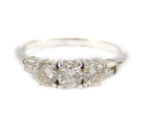 An 18ct white gold and diamond five stone ring, set with brilliant and baguette cut diamonds, high claw set, approx 1.3cts, s