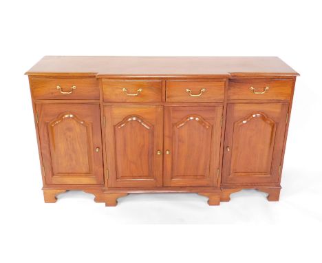 A mahogany breakfront sideboard, with four drawers over four doors, raised on bracket feet, 86cm H, 153cm W, 43cm D.