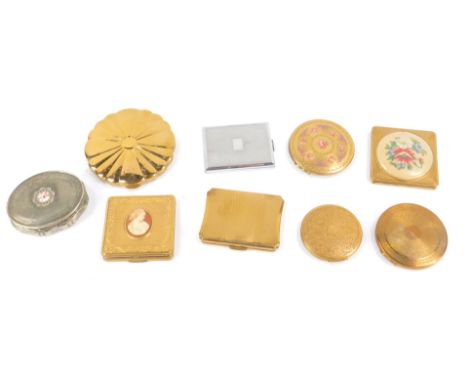 Kigu compacts, including a brass compact set with a cameo portrait of a lady, oval Concerto musical compact, and a compact em