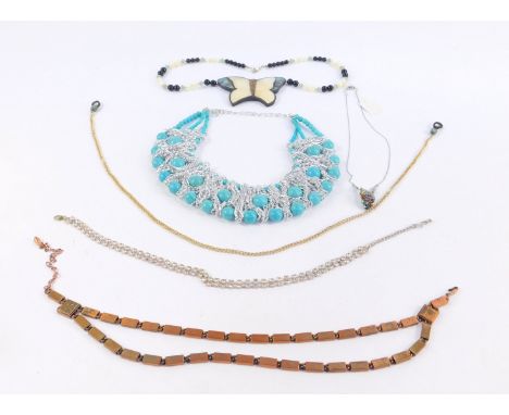 Modern costume jewellery, including a graduated oblong necklace, mother of pearl butterfly pendant, other beaded necklaces, e