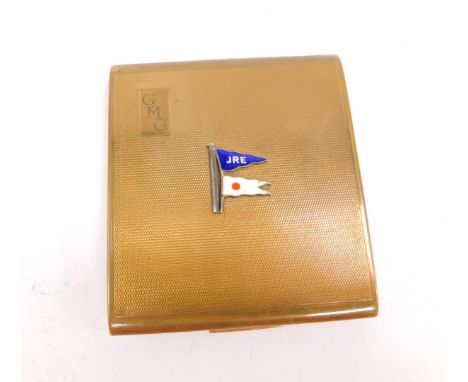 A Stratton brass and enamel compact, with engine turned decoration, monogrammed reserve, bearing pennant for J R E and a Comm