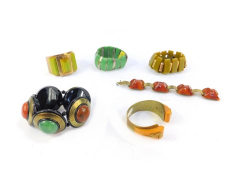 Various stone set bangles in the Art Nouveau style, to including a Bakelite and sea horse bangle, an Art Deco style plastic c