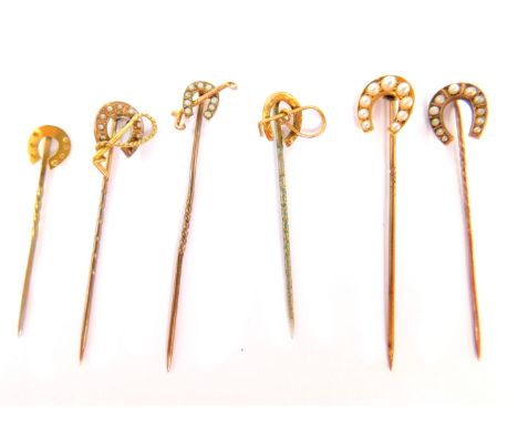 Various stick pins, comprising six horseshoe pins, some set with seed pearls, four marked 9ct, one marked 15ct and another un