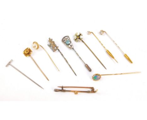 Victorian and later gem set tie pins, including an enamel cross set with a crown and initials VDEW, pearl and opal set pins, 