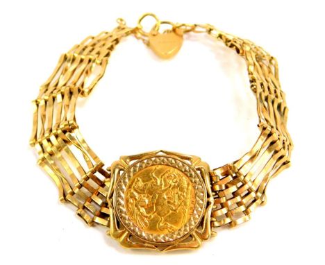 An Edward VII gold half sovereign 1908, in a 9ct gold six bar gate bracelet with heart shaped padlock clasp and safety chain 
