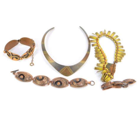 Three stylised copper bracelets, a copper and yellow enamel necklace and a tricolour metal choker. (5)