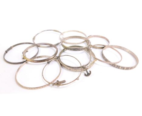 Silver and other bangles, including a hinged bangle set with marcasites, an anchor bracelet, torc bangle, hinged bangles, etc