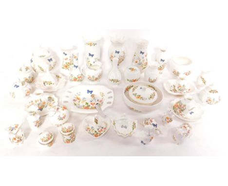 Aynsley porcelain vases, bowls and ornaments, decorated in the Cottage Garden pattern, including figures of an owl, recumbent