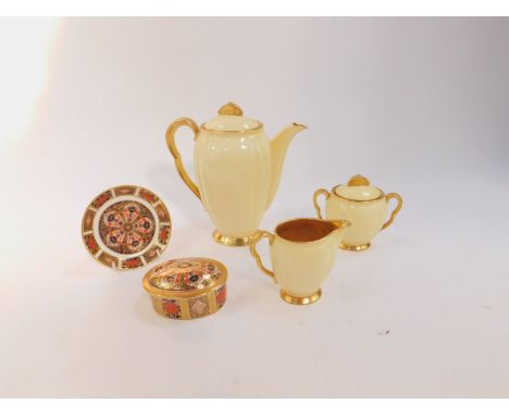 A Carltonware 1930's cream and gilt three piece coffee set, comprising coffee pot, cream jug and sucrier, together with a Roy